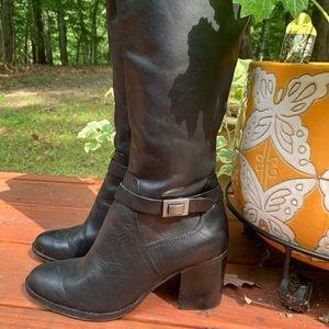Black knee high zipper boots with matte silver buckle details. Size 9